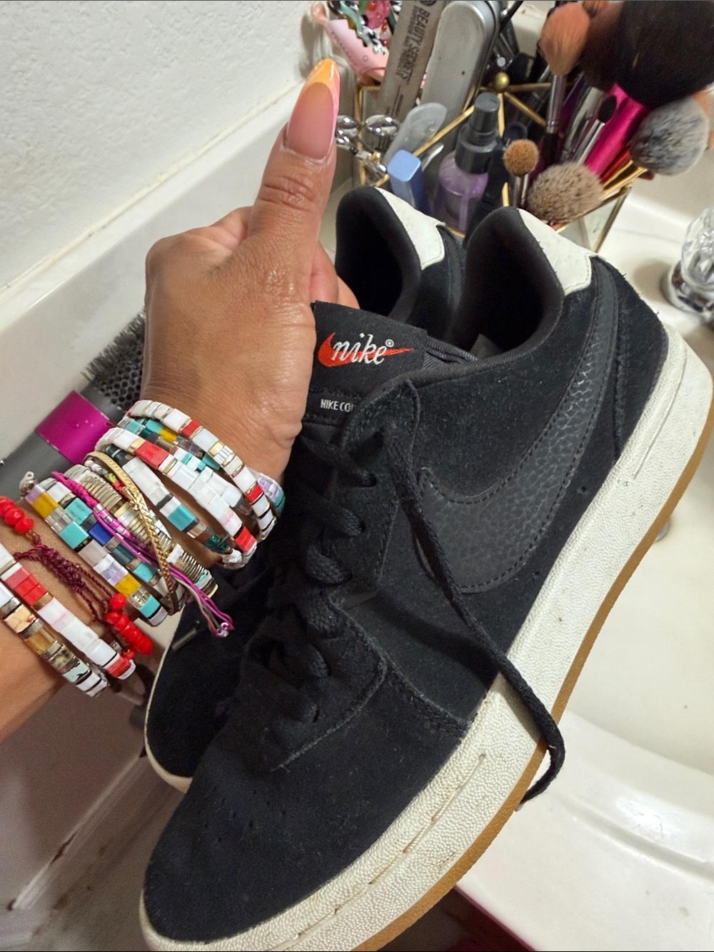 Nike Black Suede Low-Top Sneakers with White Midsole and Gum Outsole